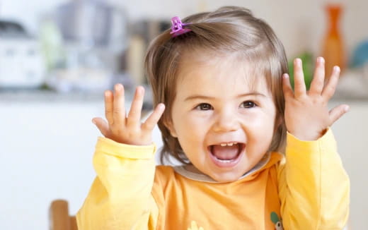 a child with her hands up