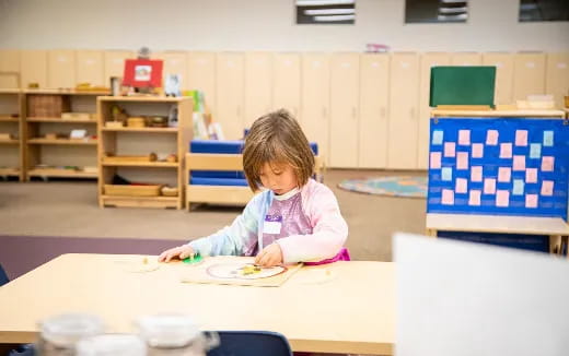 a child sitting at a table