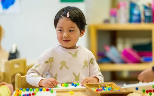 a young girl playing with toys