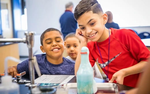 a few young boys smiling