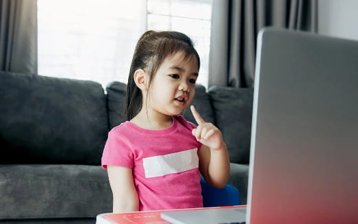 a girl sitting at a table