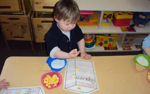 a child sitting at a table