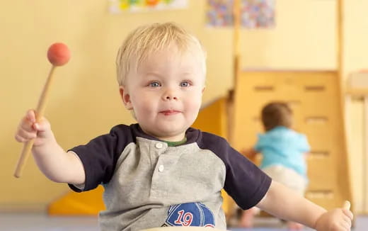 a boy holding a stick
