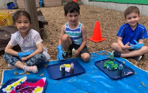 children sitting on the ground