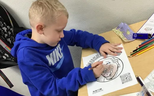 a child drawing on a paper