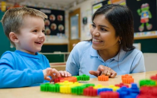 a person and a child playing with toys