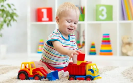 a baby playing with toys