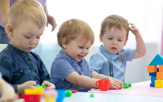 a group of boys playing with toys