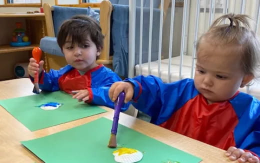 a couple of kids playing with toys