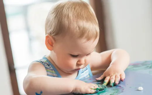 a baby playing with a toy