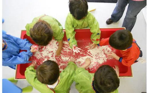 a group of children painting