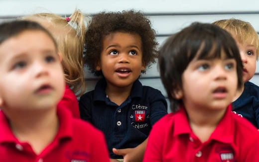 a group of children posing for the camera