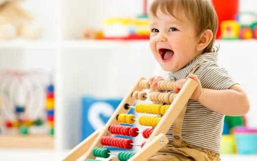 a baby playing with toys