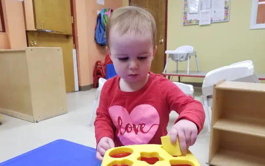 a baby playing with toys