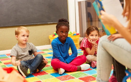 a group of children sitting on the floor