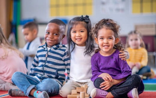 a group of children sitting on the floor