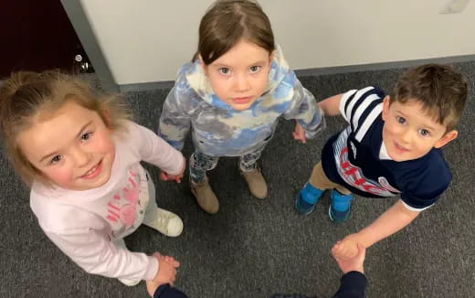 a group of children sitting on the floor