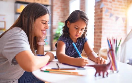 a person and a girl studying