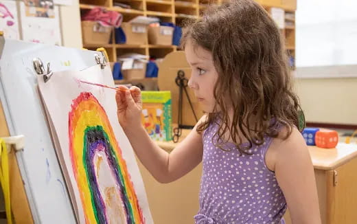 a young girl painting