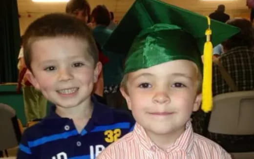 a couple of boys smiling