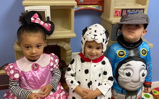 a group of children wearing clothing