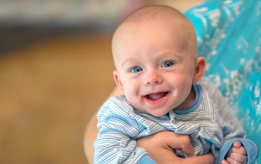 a baby with a surprised expression