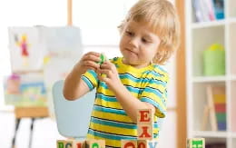 a child holding a toy