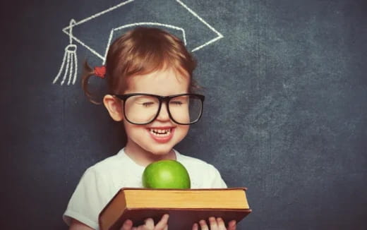 a child holding an apple