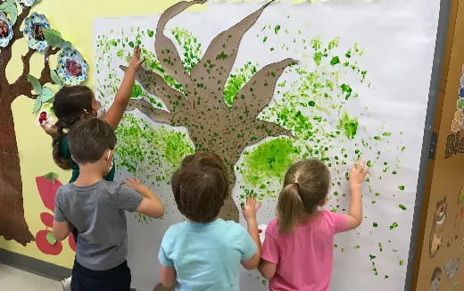 a group of children painting