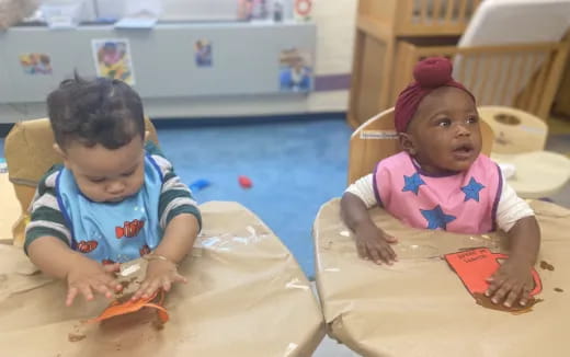 a couple of children playing with toys