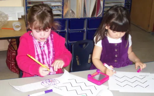 a couple of young girls painting