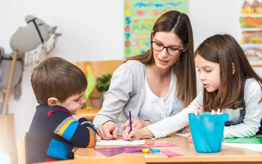 a person and a child sitting at a table