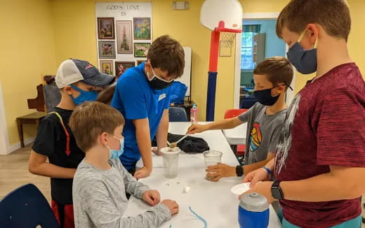 a group of people around a table