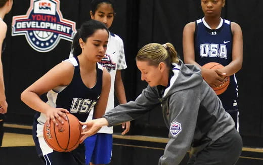 a person holding a basketball