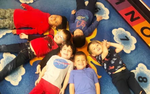 a group of children lying on the ground