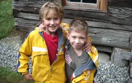 a couple of children posing for the camera