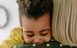 a child sleeping on a couch