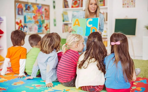 a group of children sitting on the floor