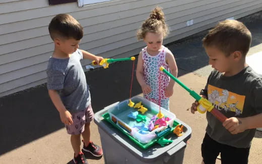 kids playing with a cake