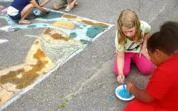 a group of children painting