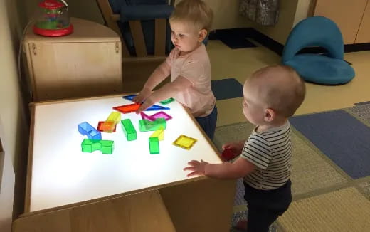 two babies playing with toys