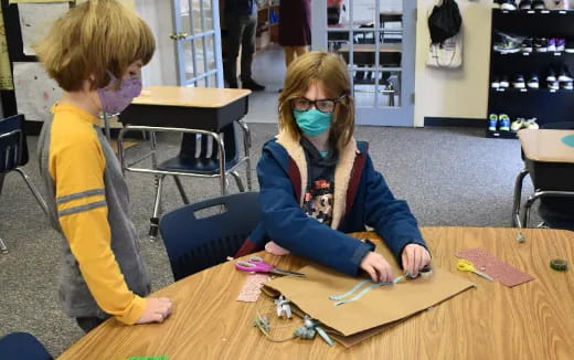 a person and a boy painting