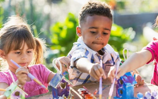 a few children playing in a garden