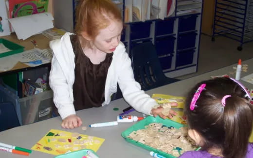 a few young girls painting