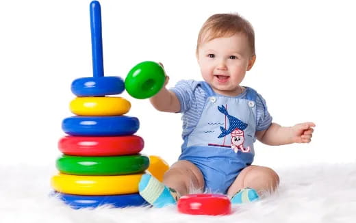 a baby playing with toys
