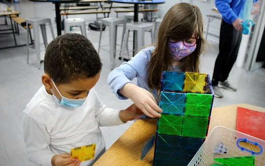 a young boy and girl painting