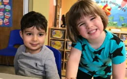 a couple of boys smiling