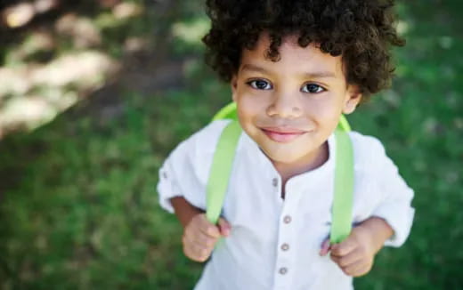 a child with a green ribbon