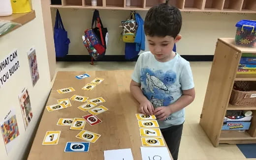 a boy playing with a toy