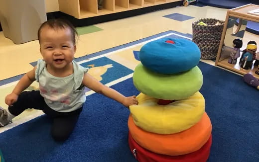 a baby playing with a toy